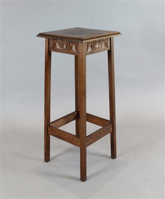 Attributed to Alfred Waterhouse. An oak jardiniere table, with moulded rectangular top and carved frieze, on W.1ft 3in.